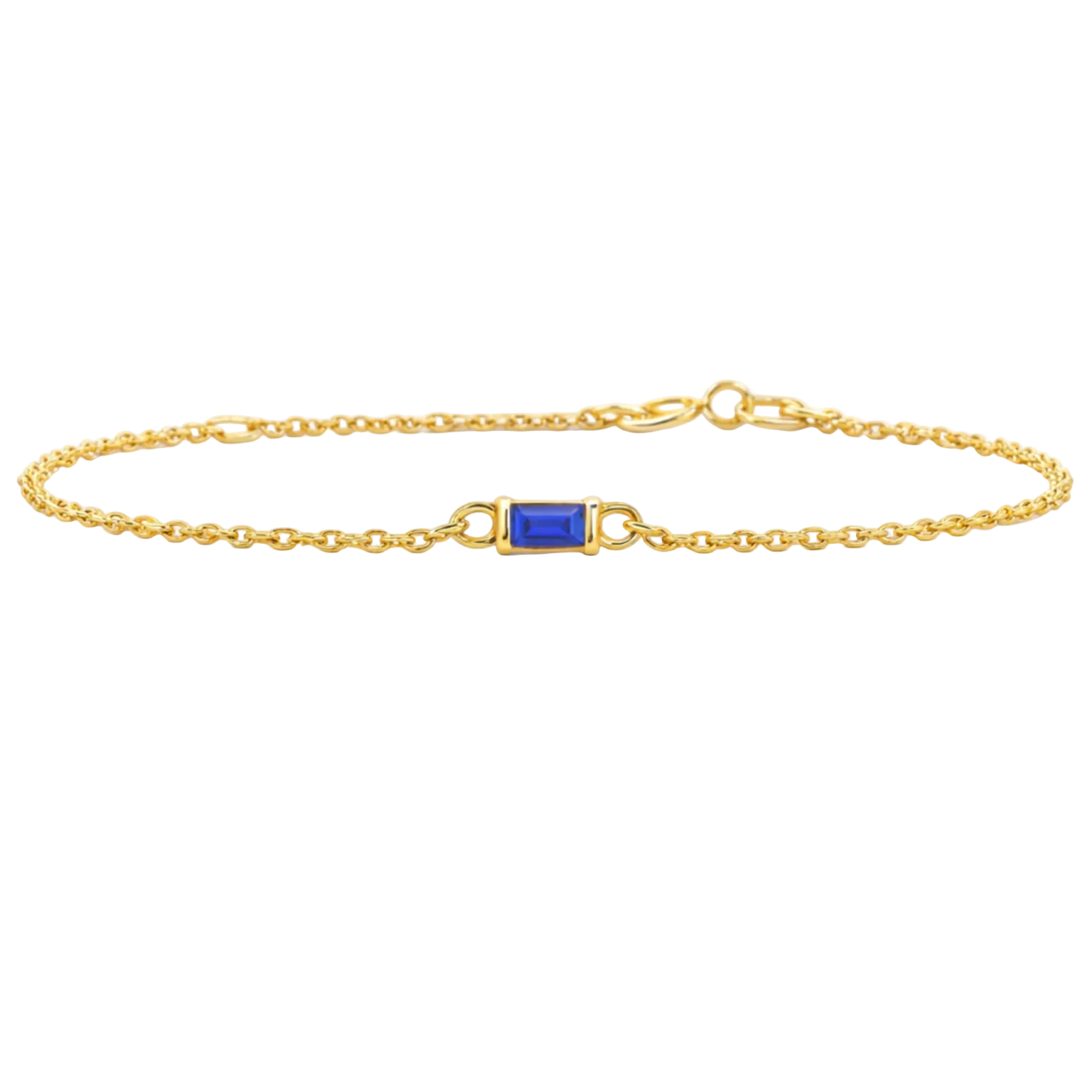 Gold bracelet with a blue gemstone on a white background
