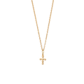Gold necklace with a small cross pendant on a white textured background